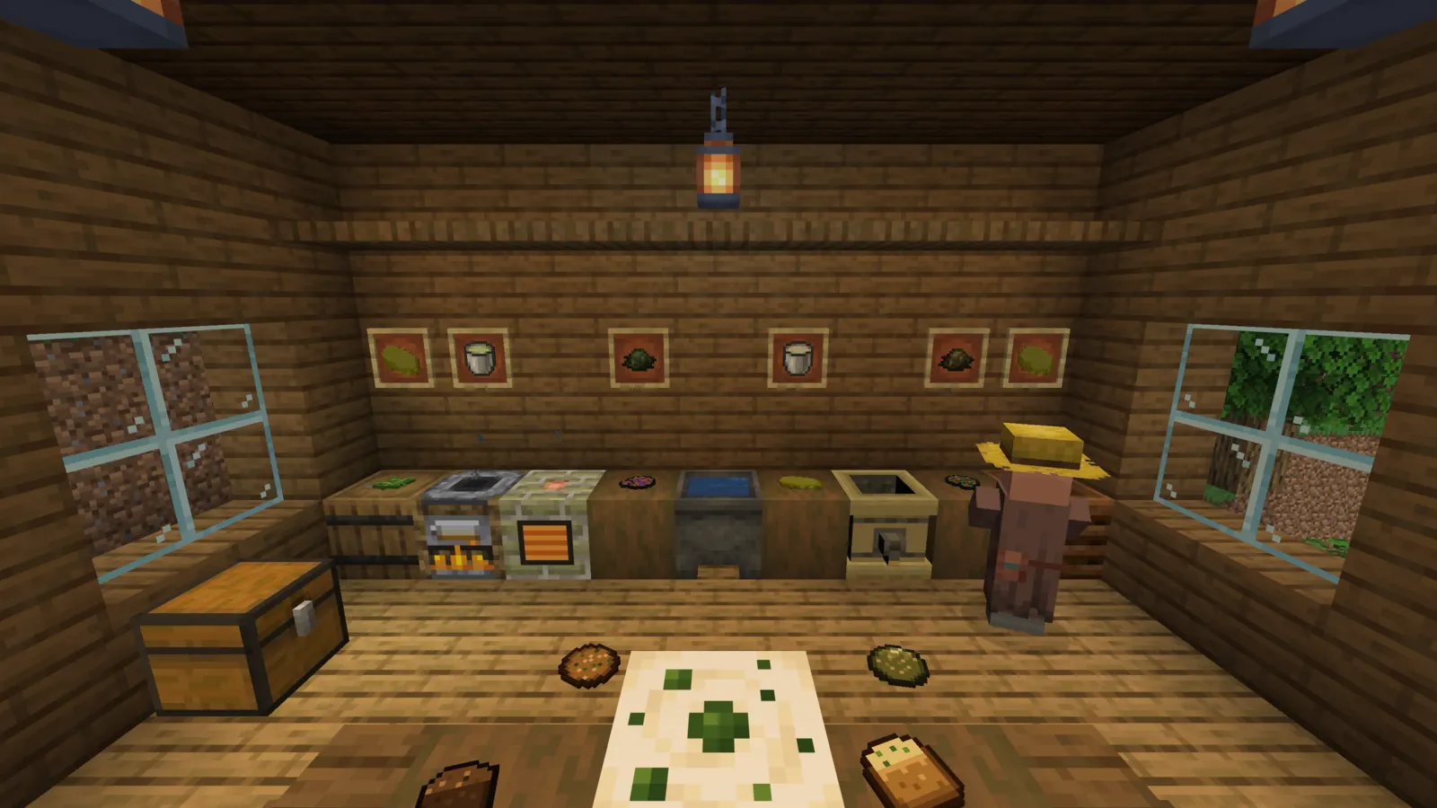 A cozy wooden kitchen: the Decarboxylator, a water cauldron and the Infuser line the counter under framed buds and milk buckets, a farmer villager stands by, and a space cake sits on the table with cookies and brownies around it.